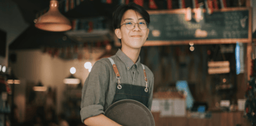 Image of a young worker in a restaurant setting 