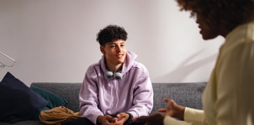 Parent talking with son.