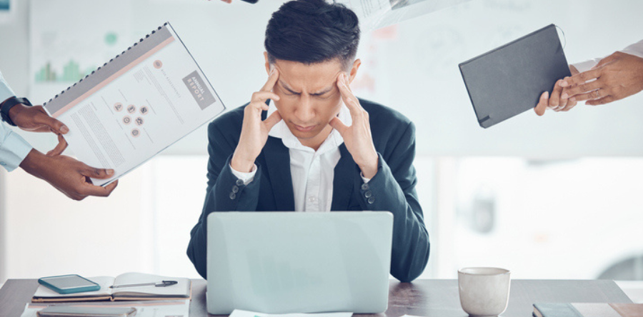Image of a businessman stress, tired and burnout with work pressure
