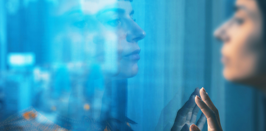 Isolated woman in window reflection