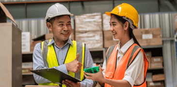Manager and young worker in a warehouse.