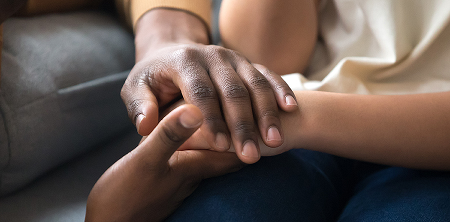 Hand clasping in comfort.