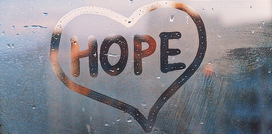Hope written in a heart on a steamy mirror