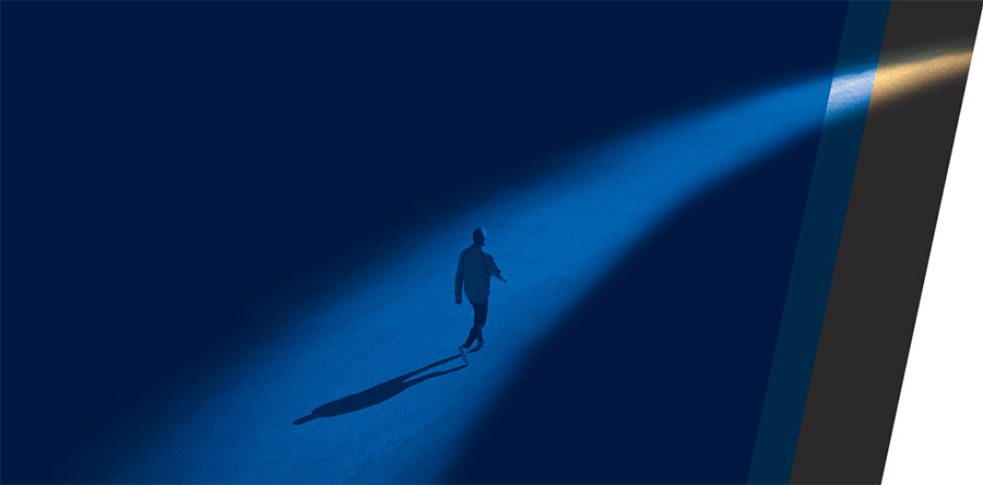 Silhouette image of a person walking in dark blue and white background. 